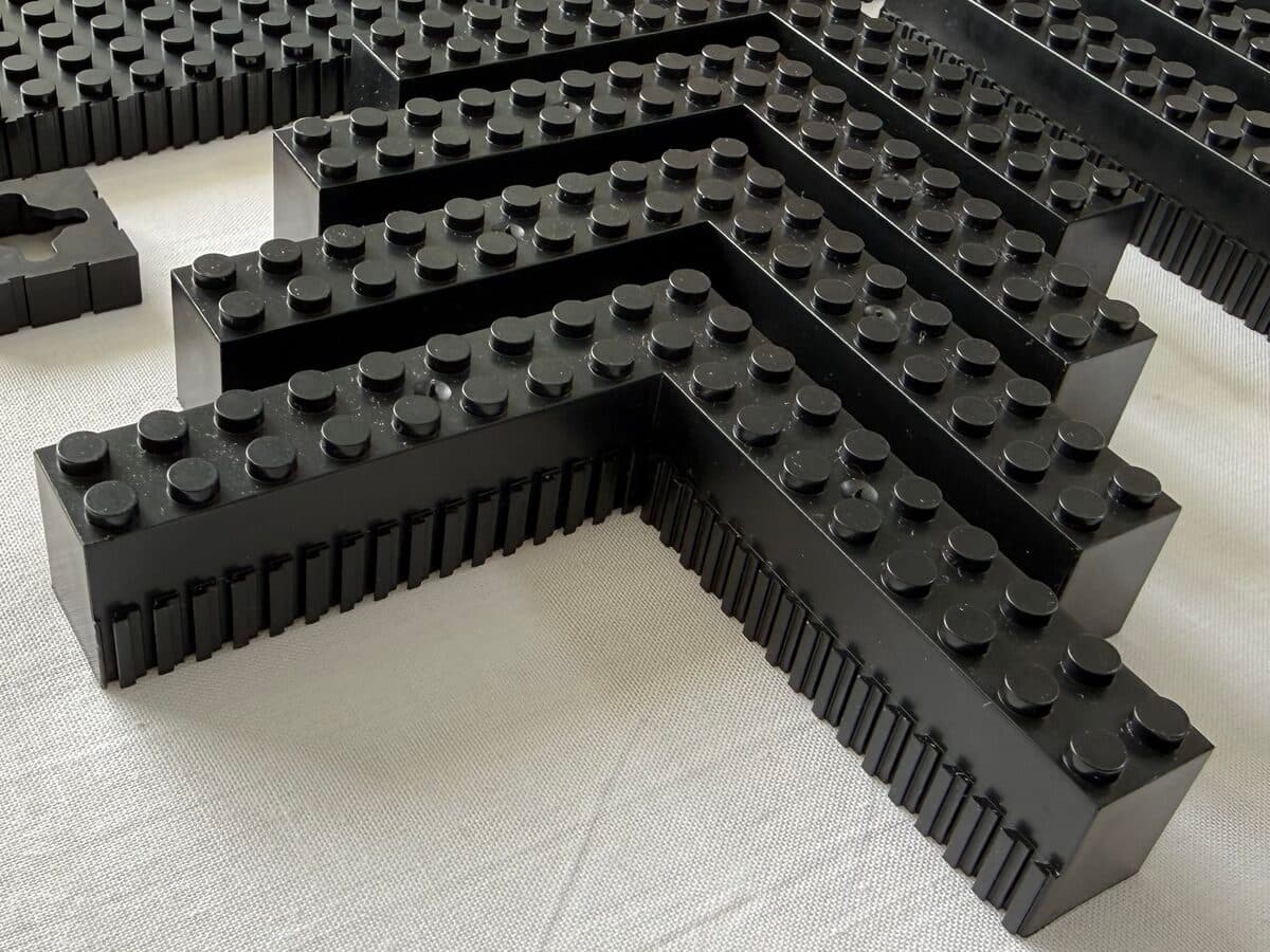Brick-built frame rails and corner pieces laid out